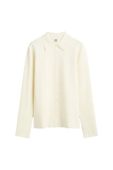 Compact knit buttoned top — packshot
