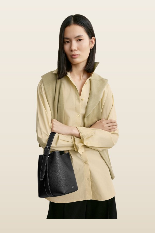 Small belted grained-leather tote — model back