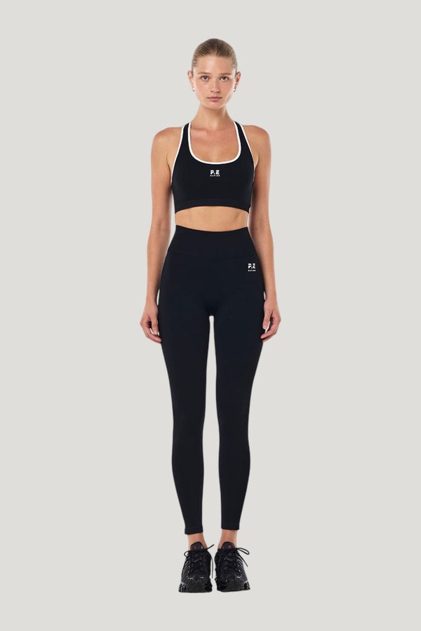 Adaption Seamless Sports Bra In Black & Optic — model front