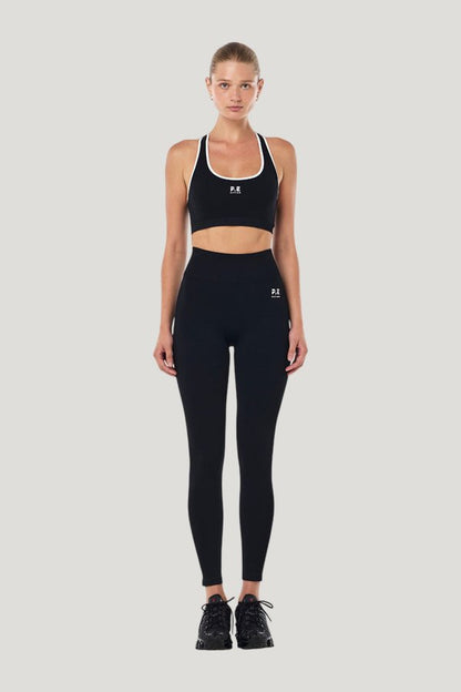 Adaption Seamless Sports Bra In Black & Optic — model front