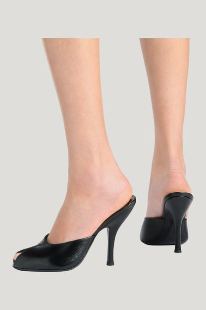 Date Mule in Black Creased Leather — model side