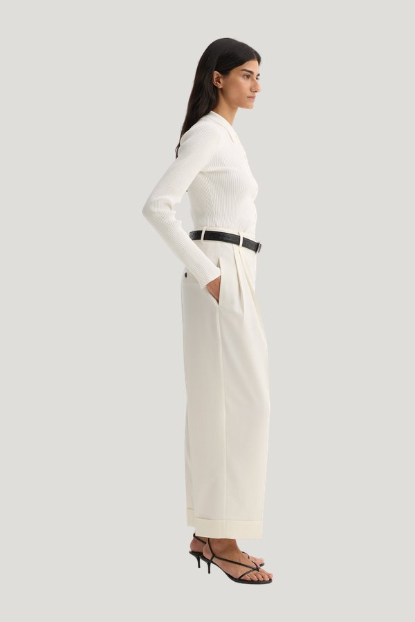 High-waist turn-up trousers — model side