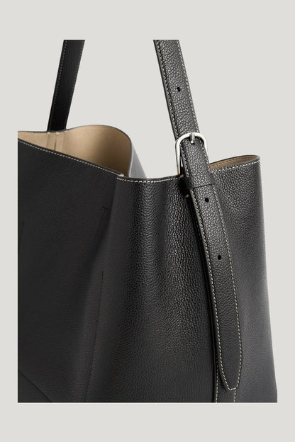Medium belted grained-leather tote — model side