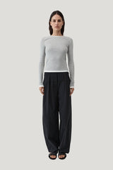 Relaxed Pleat Pants — model front
