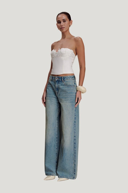 Romi Mid Rise Wide Leg Jeans - Faded Mid — model side