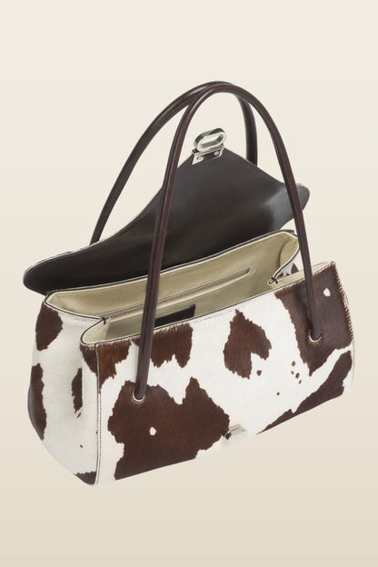 White and brown cow-print ponyhair E/W shoulder bag — model back
