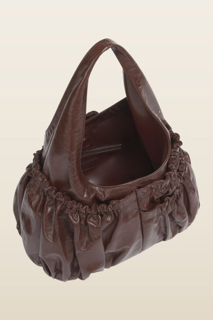 Brown leather gathered hobo bag — model back