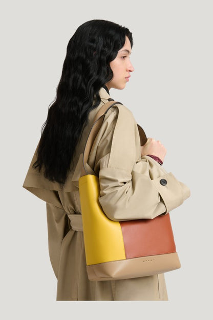 Yellow, brown and taupe leather Pod 2.0 bag — model front