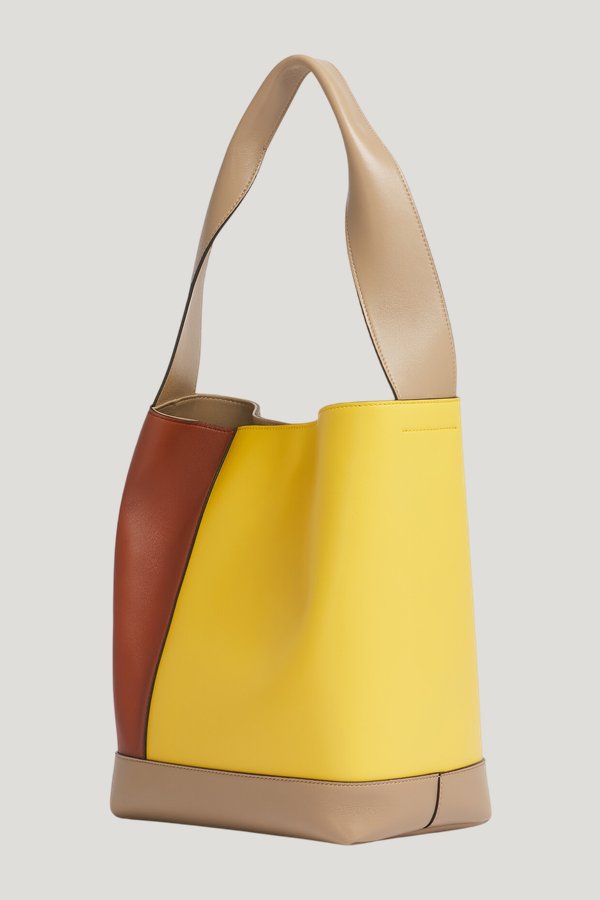 Yellow, brown and taupe leather Pod 2.0 bag — model side