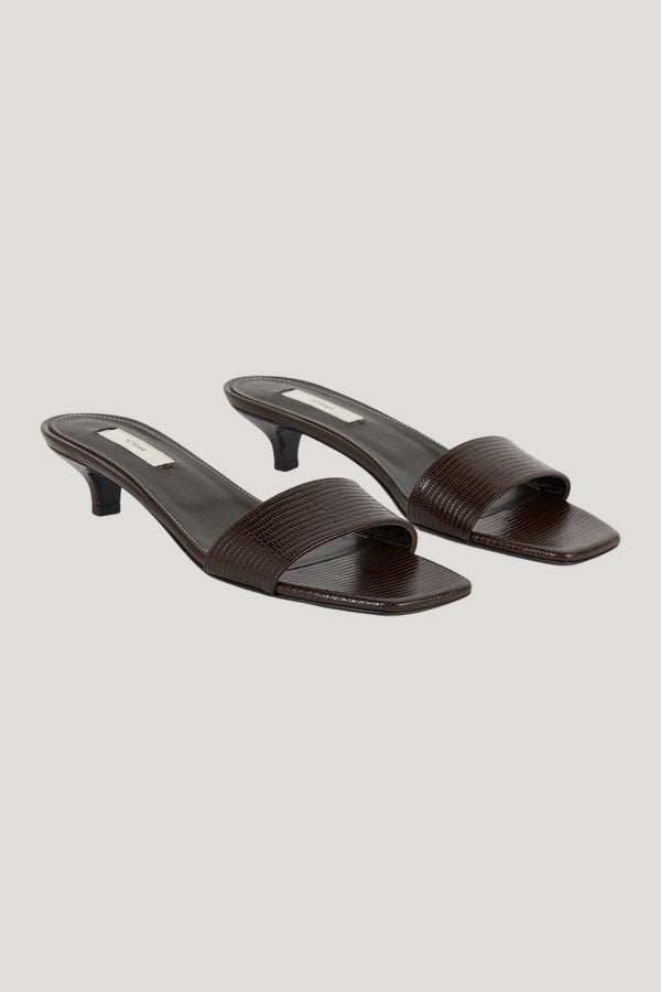 Slim lizard-embossed bandeau mules — model front