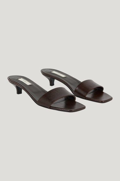 Slim lizard-embossed bandeau mules — model front