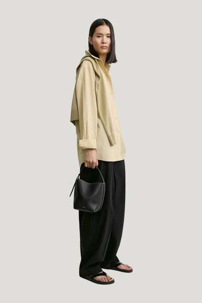 Small belted grained-leather tote — model side
