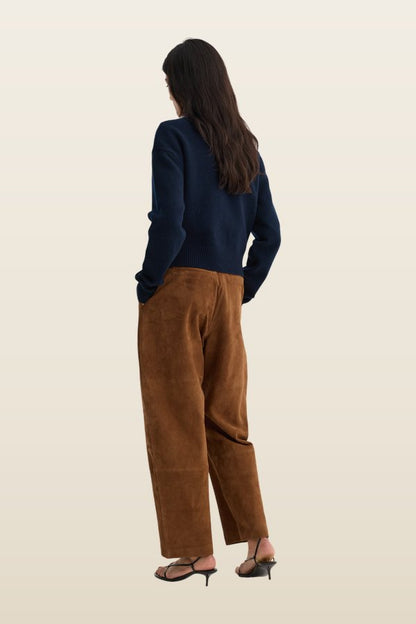 Sculptural suede trousers — model back