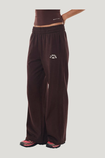Swerve Trackpant In Mahogany — model side