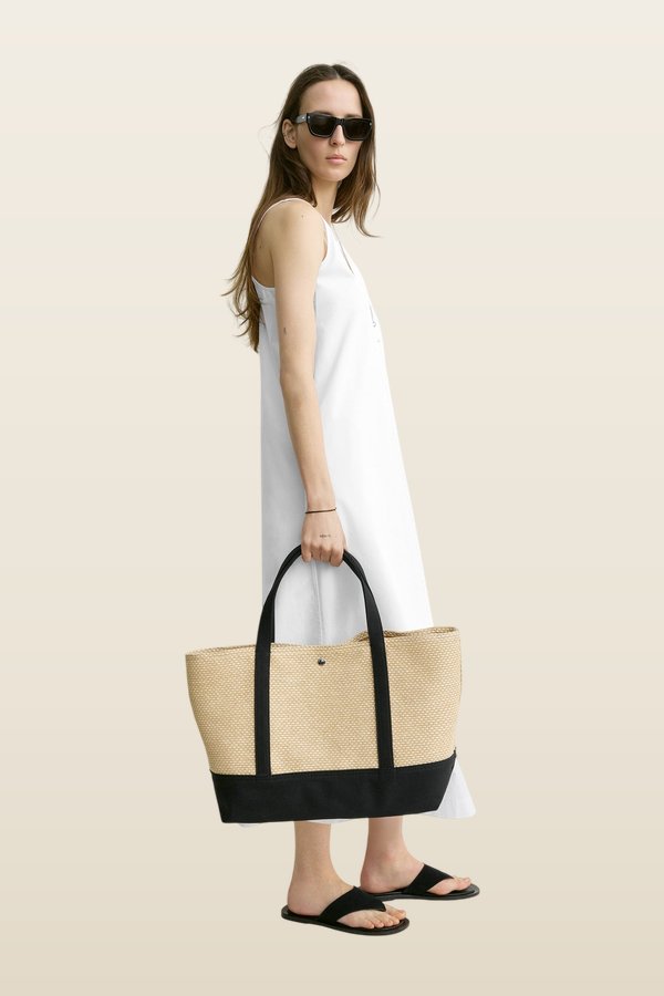 Woven beach tote — model back