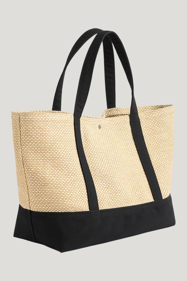 Woven beach tote — model front