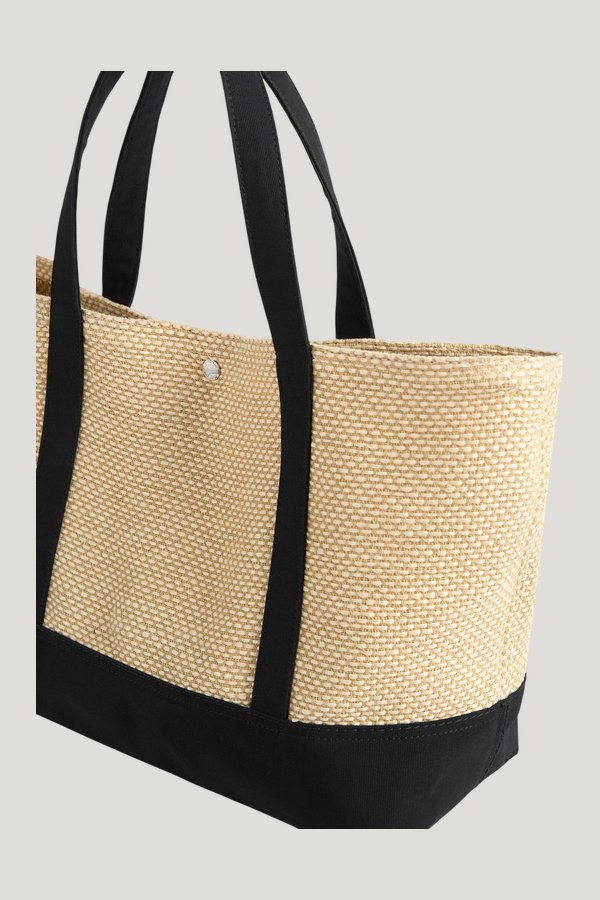 Woven beach tote — model side